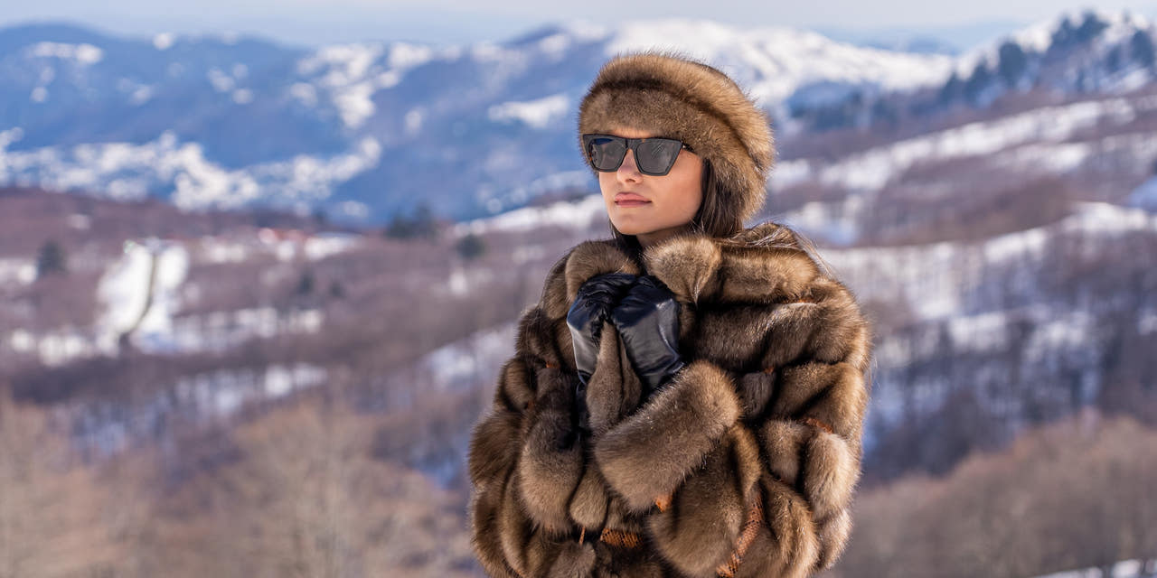 handmade russian sable fur coat and sable hat worn on snowy mountain